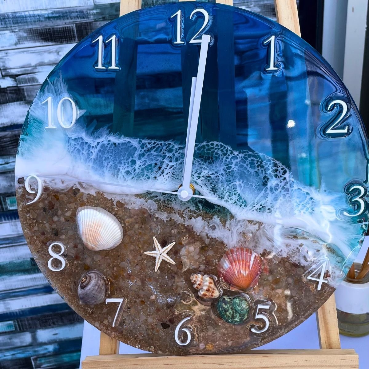reloj decorativo de playa con conchas y efecto océano
